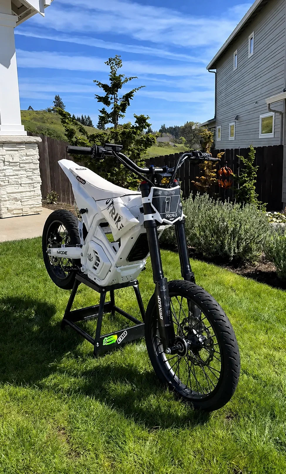 Chrome 17 inch front and 14 inch rear supermoto wheel set on a white Yozma