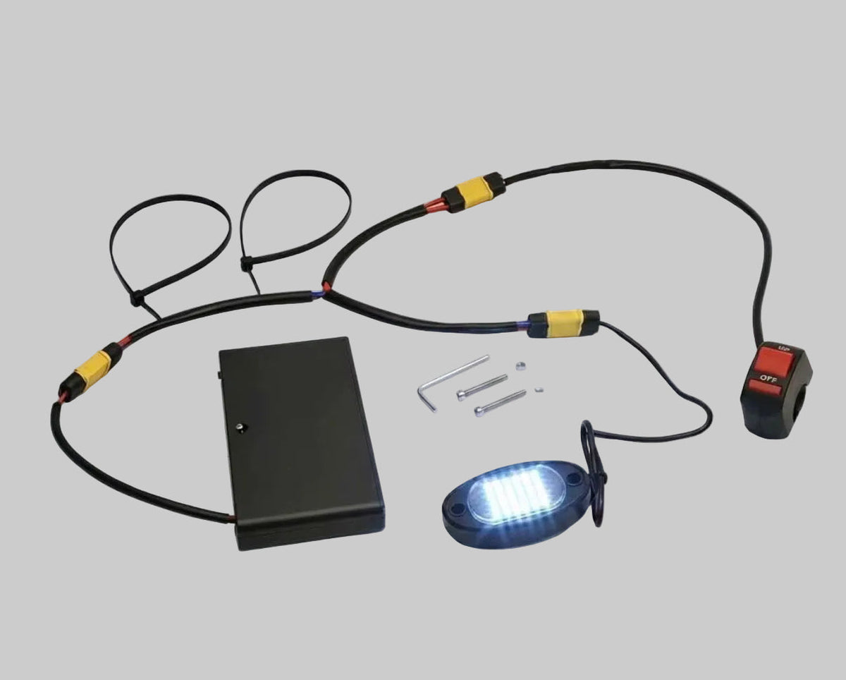 Universal LED rock light kit with white LED pod, wiring harness, switch and power box