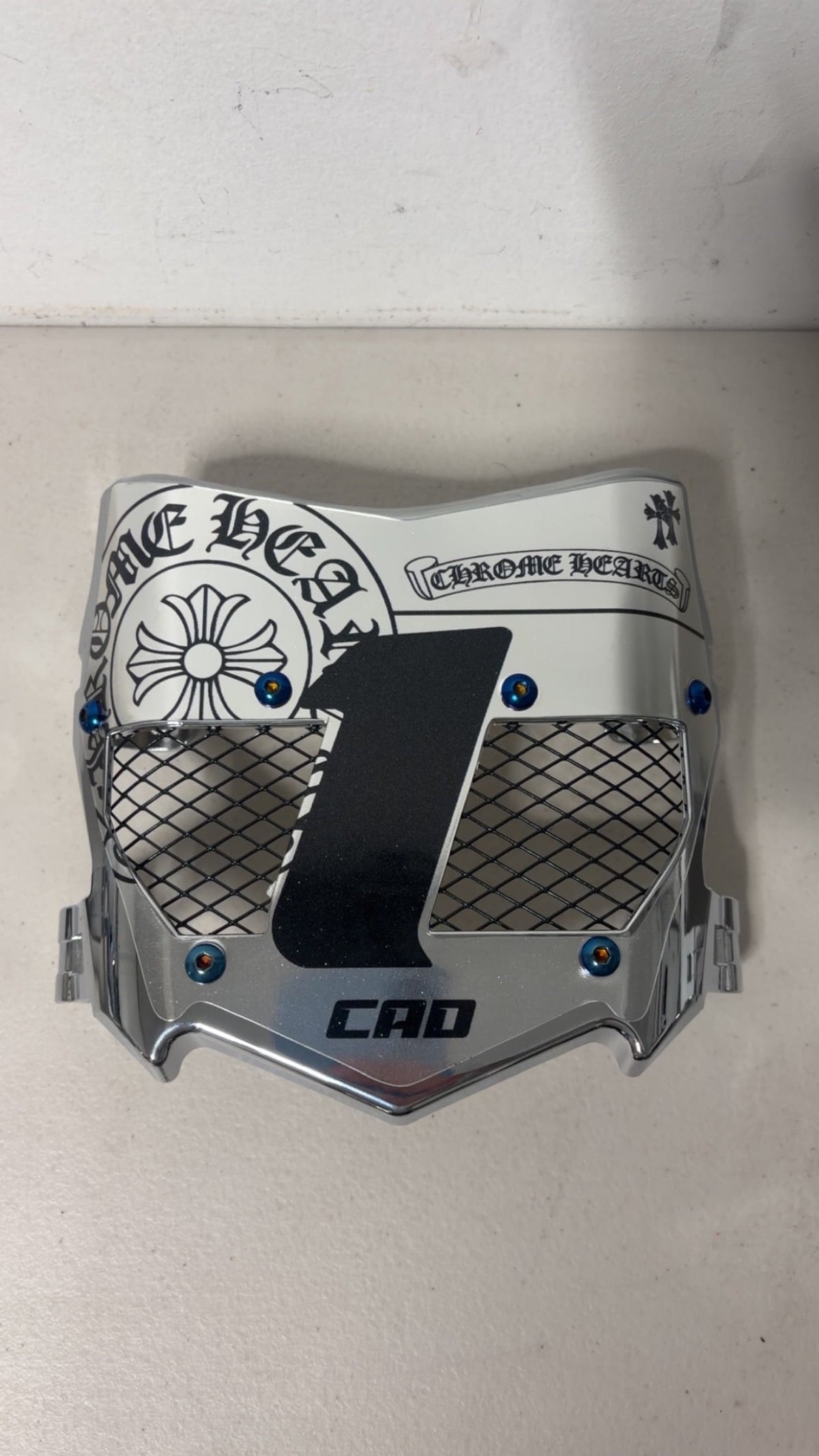 Silver chrome cross emblem titanium vented number plate